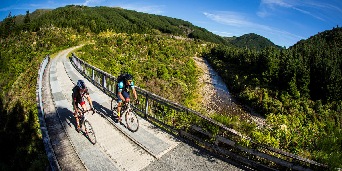 Remutaka Cycle Trail bridge and Hutt river people mountain biking v2 FillWzEyMDAsNjAwXQ